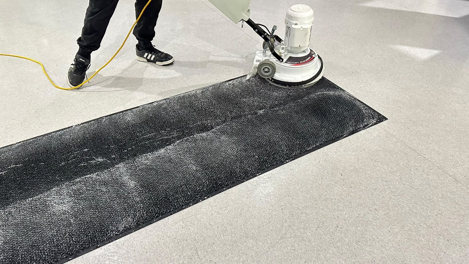 Rotary floor cleaning machine in use
