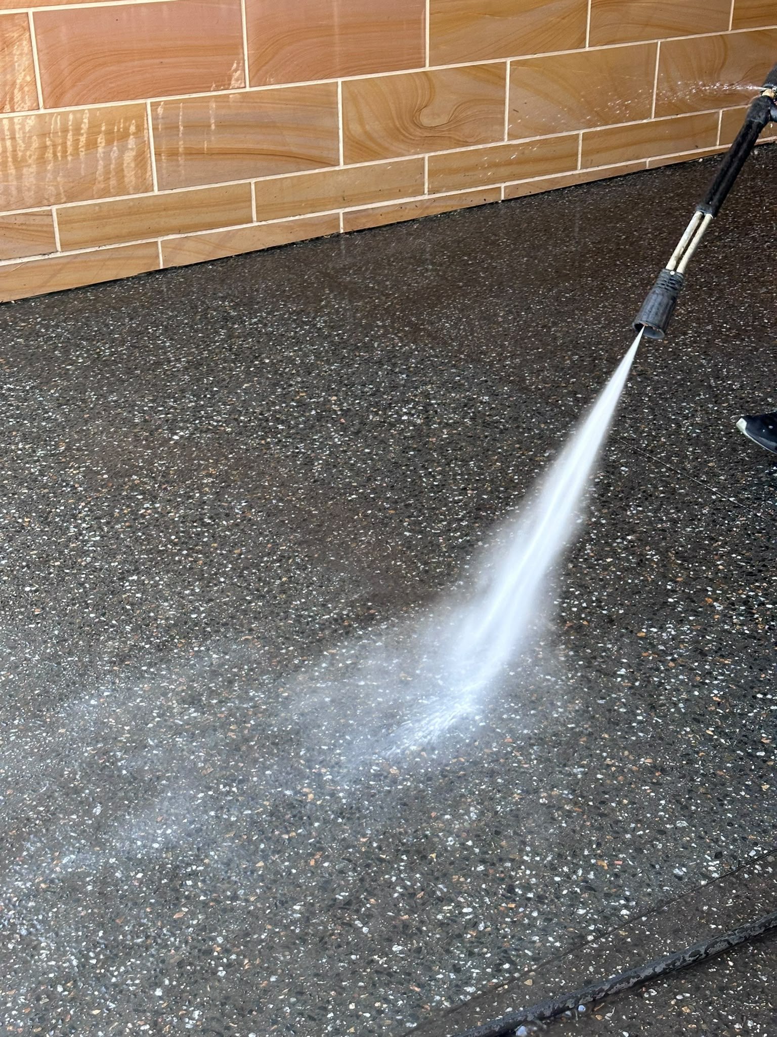 Pressure cleaning outdoor surface